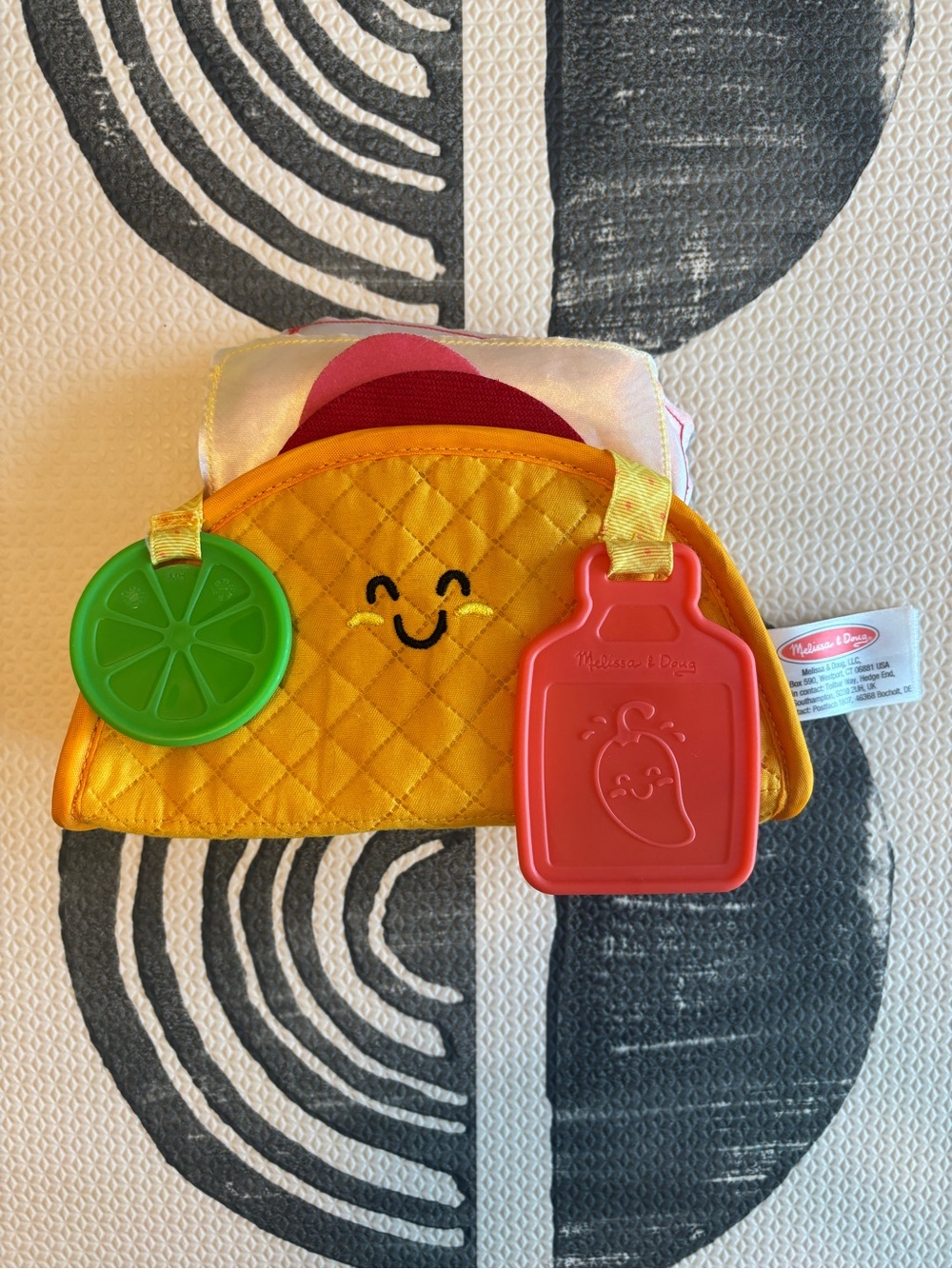 Melissa & Doug Multi-Sensory Soft Taco Fill & Spill Infant Toy